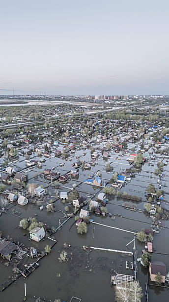 istock Global warming,climate change.Tsunami.Storms and destruction.Floods on the planet.The apocalypse, catastrophes.Natural disasters the riot.The remnants of human life are floating in dirty water.The end 2236353821