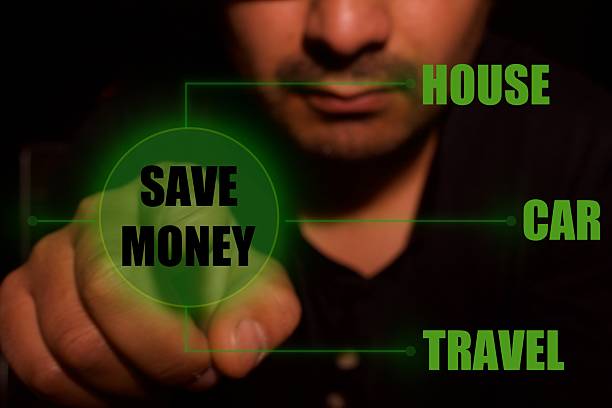 istock Man presses start button to save money 2236354944