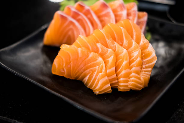 istock Salmon sashimi slice fresh serve on black dish 2236358217