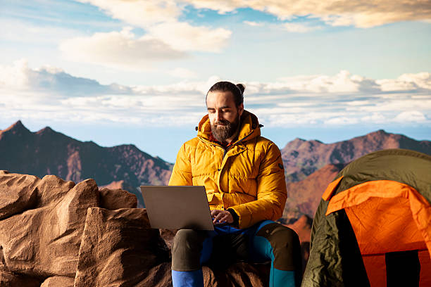 istock Hiker with a technology obsession and strong signal working in nature 2236360116