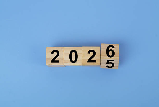 istock Cubes with numbers 2025 and 2026 on blue background. 2236367069
