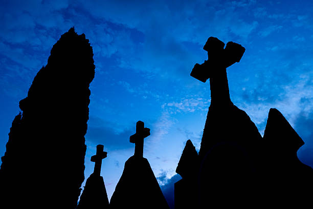 Dramatic Graveyard Tombs Against a Blue and Cloudy Sky