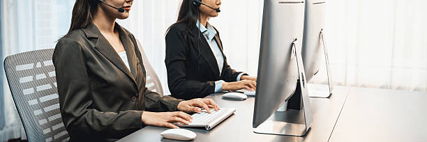 istock Panorama call center operator or telesales agent working on his desk. Prodigy 2236369739