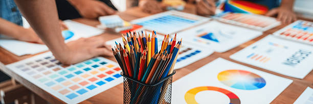 istock Graphic designer brainstorming logo and graphic arts at workshop. Scrutinize 2236370814