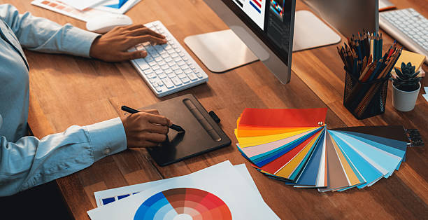 istock Graphic designer works on computer laptop with digital pen. Scrutinize 2236370861