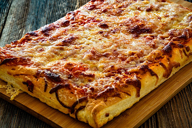 istock Pizza al metro margherita on wooden table 2236371221
