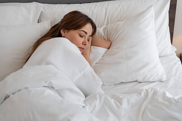 istock Caucasian woman sleeping with towel at hotel 2236371921