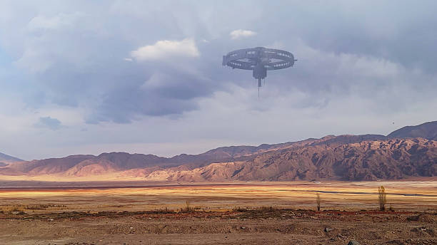 istock An alien craft floats over the dry mountain basin, illuminated by shifting light in the landscape. 2236372185