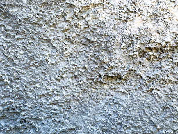 istock Close-up of rough natural rock surface with unique texture and patterns 2236372237