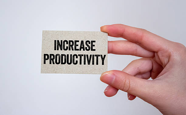 istock Increase productivity message written on a card in hand 2236373536