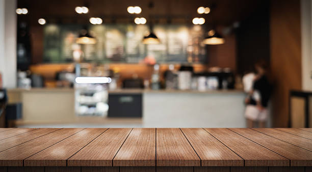 istock Empty wooden table top with lights bokeh on blur restaurant background. 2236375068
