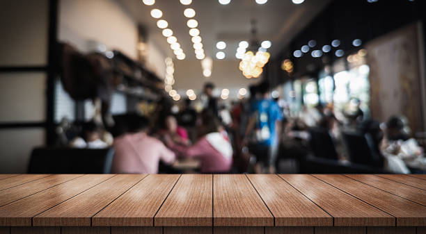 istock Empty wooden table top with lights bokeh on blur restaurant background. 2236375078