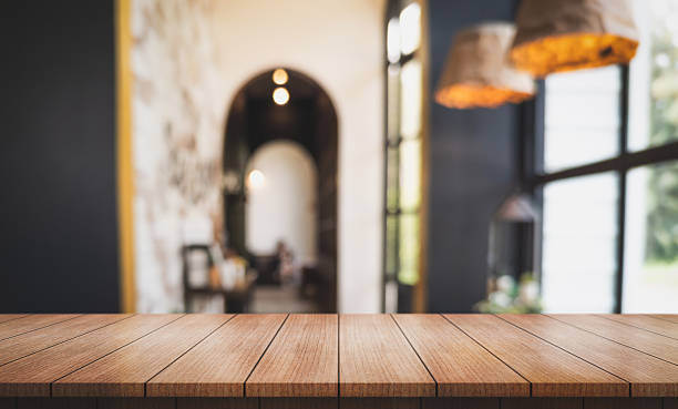 istock Empty wooden table top with lights bokeh on blur restaurant background. 2236375079