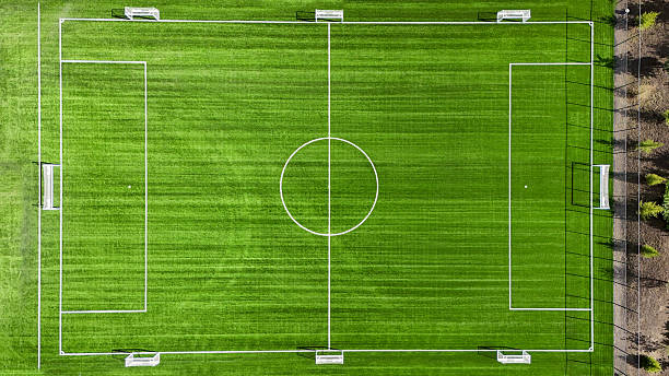 istock A soccer field with a white goal and a white circle in the middle 2236376902