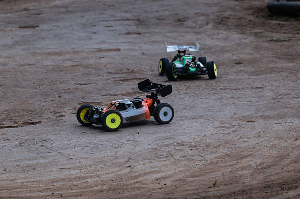 istock Radio-controlled cars racing on dirt track 2236380614