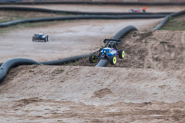 istock Radio-controlled car jumping on dirt track 2236380637