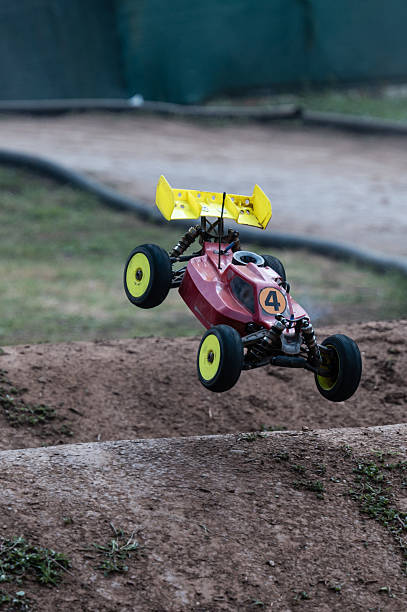 istock Radio-controlled car jumping on dirt track 2236380711