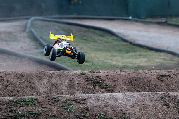 istock Radio-controlled car jumping on a dirt track during a race 2236380785