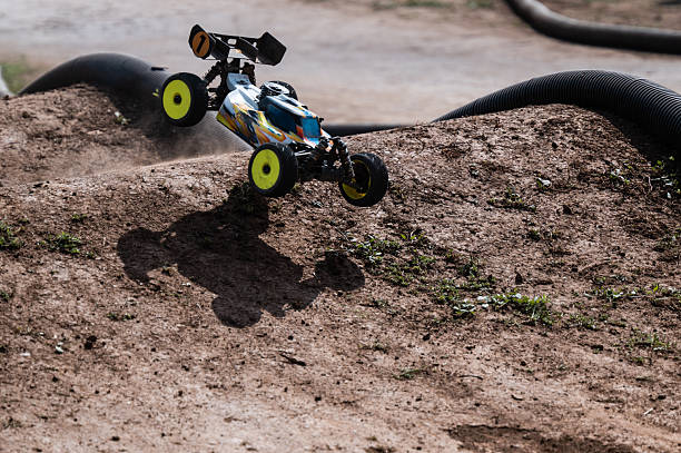 istock Radio-controlled car jumping on dirt track 2236380786