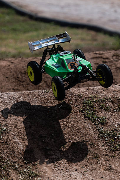istock Radio-controlled car jumping on dirt track 2236380788