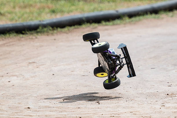 istock Radio-controlled car jumping and performing stunts on a dirt track 2236380831