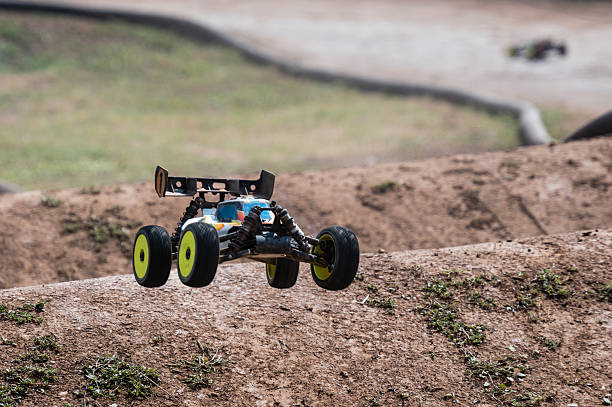 istock Radio-controlled car jumping on dirt track 2236380951