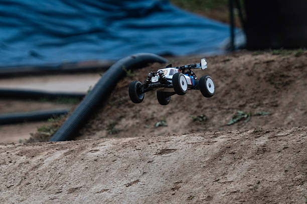 istock Radio-controlled car jumping on dirt track 2236381031