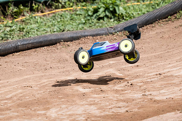istock Radio-controlled car jumping on dirt track 2236381035
