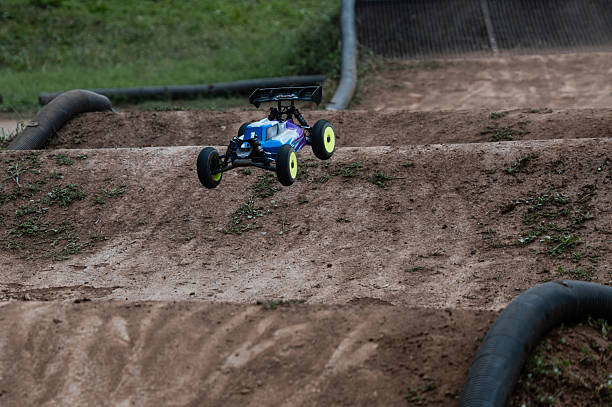 istock Radio-controlled car jumping on dirt track 2236381036