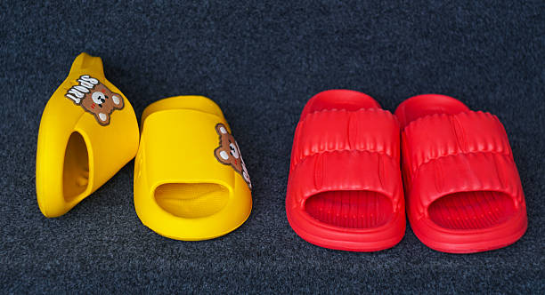 Handmade felted wool home slippers in the shape of various animals, decorated with embellishments
