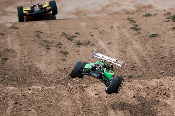istock Radio-controlled car jumping on dirt track during race 2236381128