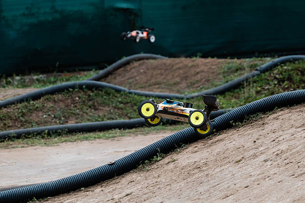 istock Radio-controlled car jumping on outdoor track during competition 2236381140