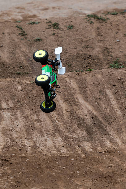 istock Radio-controlled car performing a backflip on a dirt track 2236381166