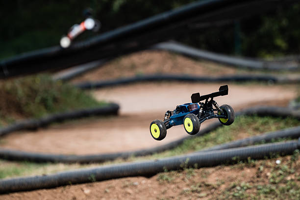 istock Radio-controlled car jumping on outdoor dirt track 2236381176