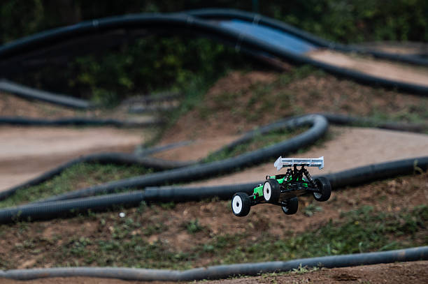 istock Radio-controlled car jumping on dirt track 2236381194
