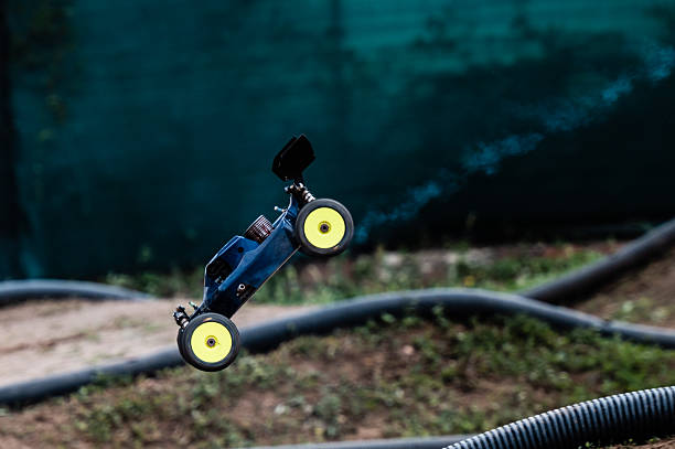 istock Radio-controlled car jumping on off-road track 2236381202