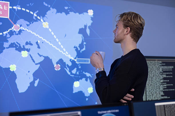 istock Cybersecurity analyst monitoring a world map on a digital display 2236382931