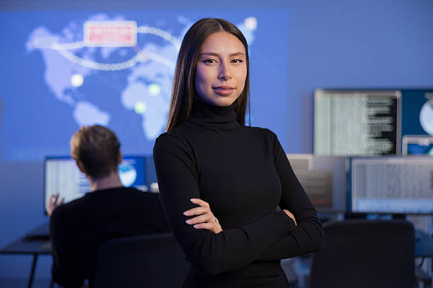 istock Professional Female Analyst Working in a Security Operations Center with Digital Displays 2236382954