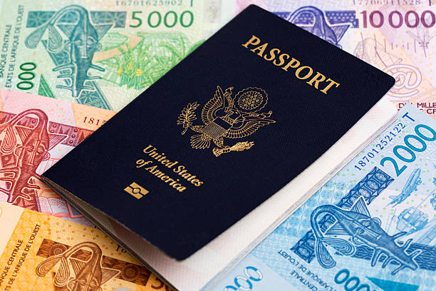istock American passport on West African money 2236383162