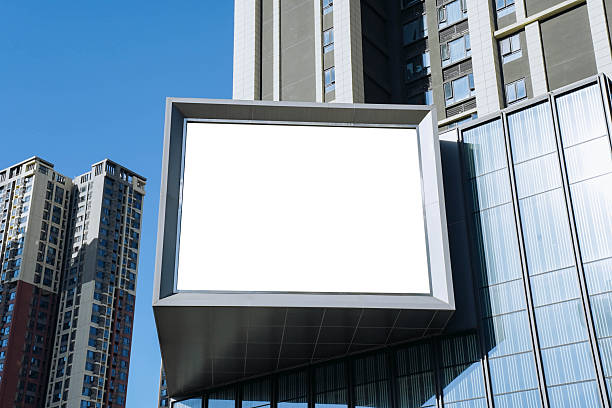 istock A mockup of a blank white billboard framed by a modern building facade, ideal for advertising 2236386046