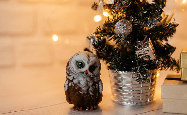 istock New Year's small tree with gifts. Owl under the Christmas tree 2236386055