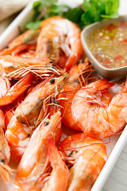 istock Grilled shrimps with spicy sauce in a white tray. 2236387839
