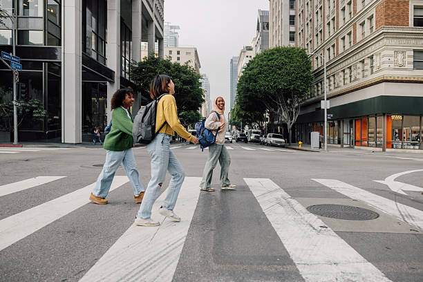 istock Three female students walking in downtown after school 2236392713