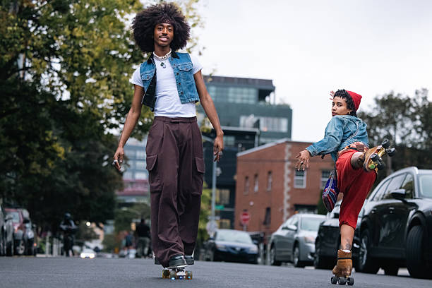 istock Friends on roller skates and penny board in Williamsburg NYC 2236393627