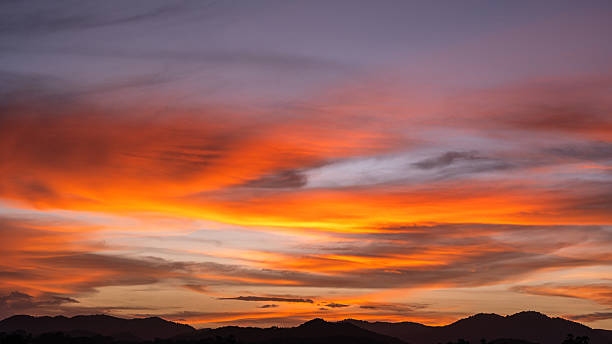 istock Dramatic Dusk, Evening Sky Clouds on Twilight over mountain horizon landscape Orange, purple Sunset Summer sky Golden Hour 2236398588