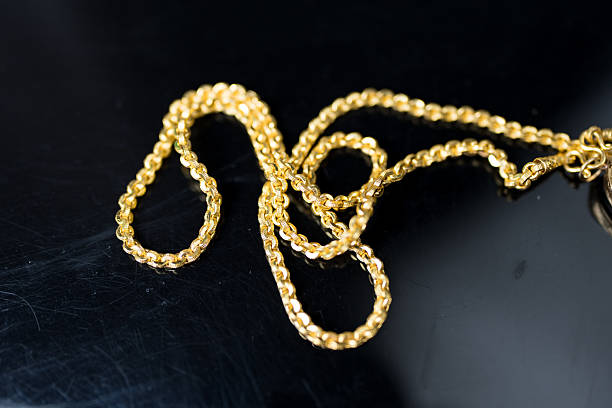 istock Gold chain necklace on a black background 2236398745