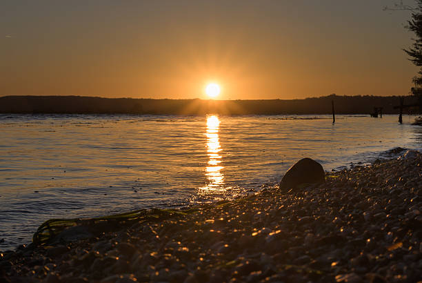 istock The sun rises from behind the hills. 2236400404
