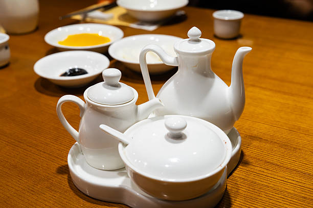 table setting with various white ceramic wares served at the Chinese restaurant