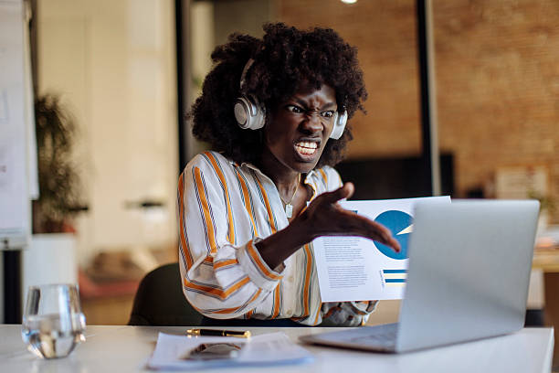 istock Frustrated Woman Discussing Business Report While Video Conferencing in an Office Setting 2236408265