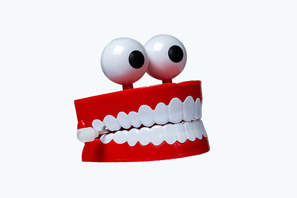 Wind up walking chattering teeth - white background